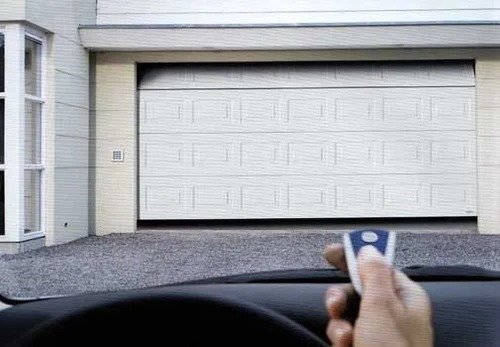 Sectional overhead garage door panel installation