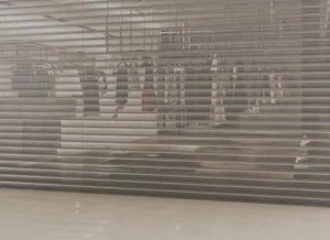 Perforated see-through roller shutter door for storefront